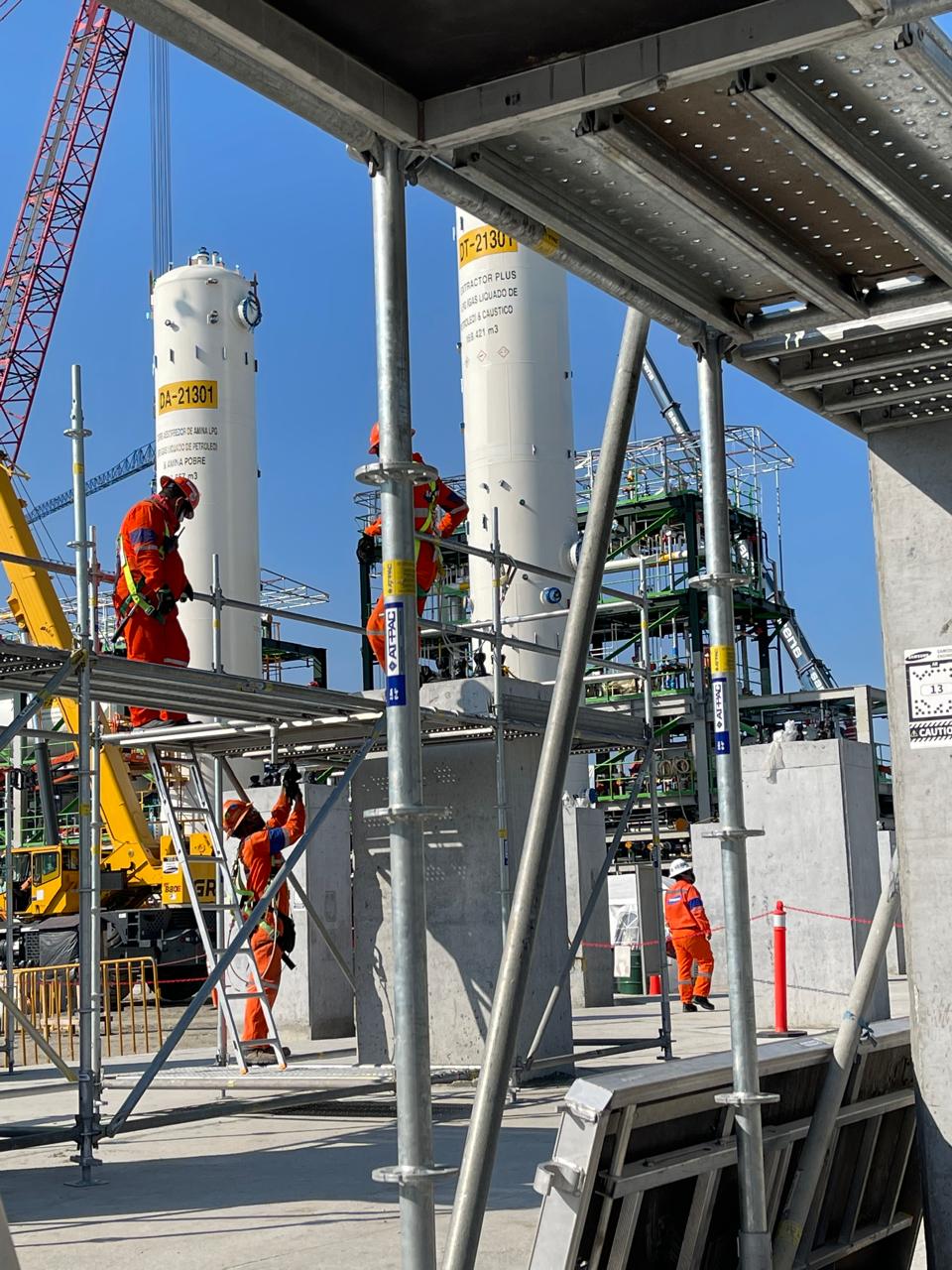 VEPSOL crew working on scaffolding next to industrial tanks