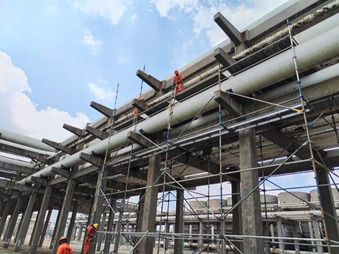 Scaffolding installed on an industrial structure with elevated pipework